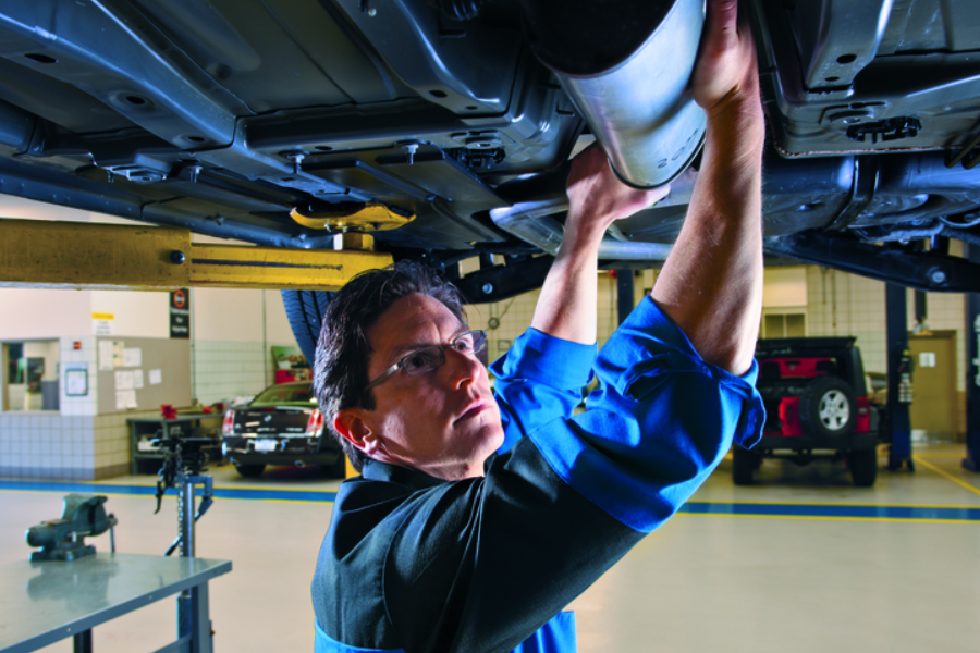 Mechanic changing oil at Criswell Chevrolet GMC of Gaithersburg dealership