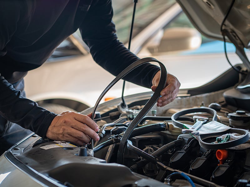 Mechanic changing the car-belt at Criswell Chevrolet GMC of Gaithersburg dealership